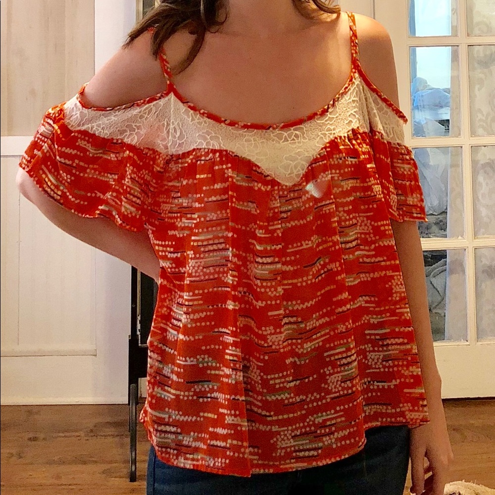 Orange with lace detail cold shoulder top.